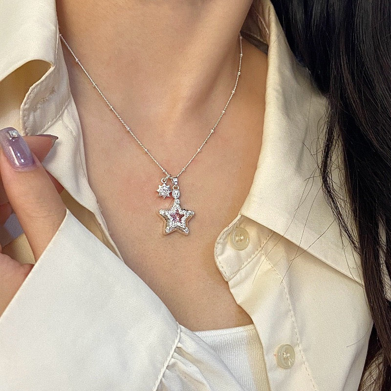 Star-themed earrings with zircon accents and a matching necklace set.