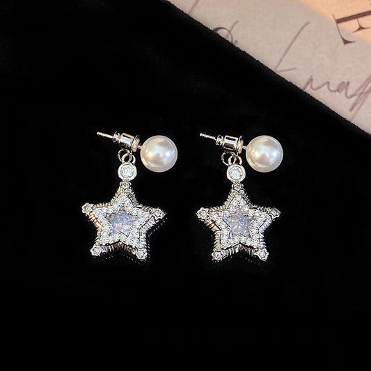Star-themed earrings with zircon accents and a matching necklace set.