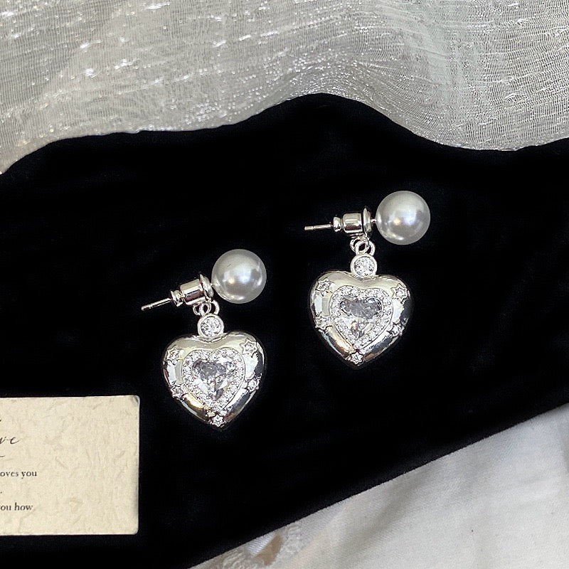 Star-themed earrings with zircon accents and a matching necklace set.